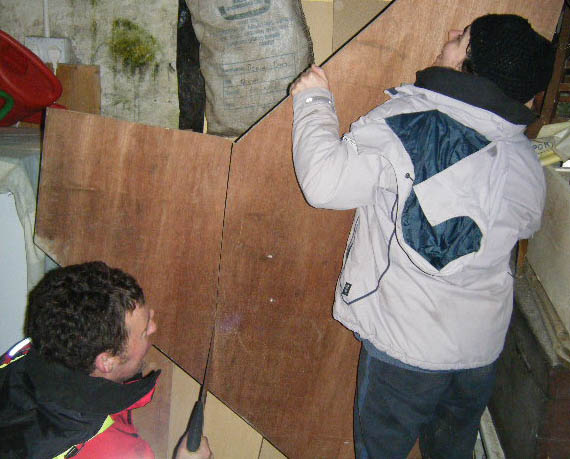 Douglas and Marianne cut some plywood for decking. Photo: SR